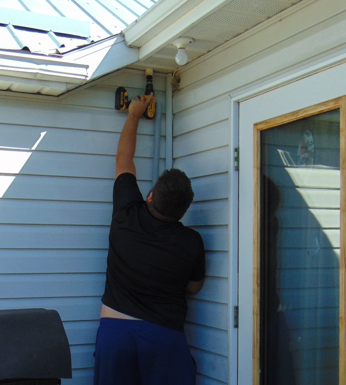Ready Tech installer completing exterior technology installation work.